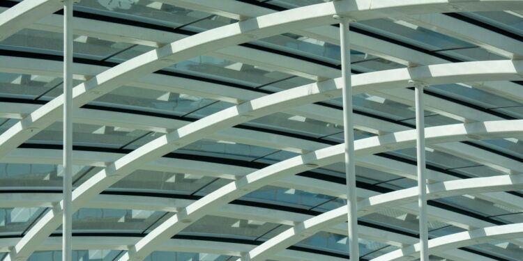 Close-up of a contemporary glass roof featuring sleek lines and geometric patterns.