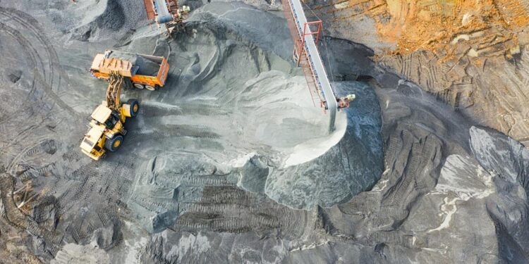 A top-down view showcasing mining operations with excavators and conveyor belts.