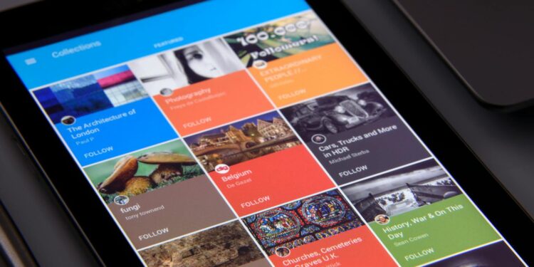 Close-up of a tablet displaying diverse content collections in a grid format.