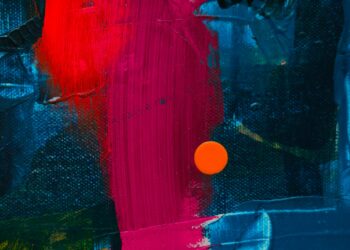 Dynamic close-up of a colorful abstract acrylic painting featuring bold textures.