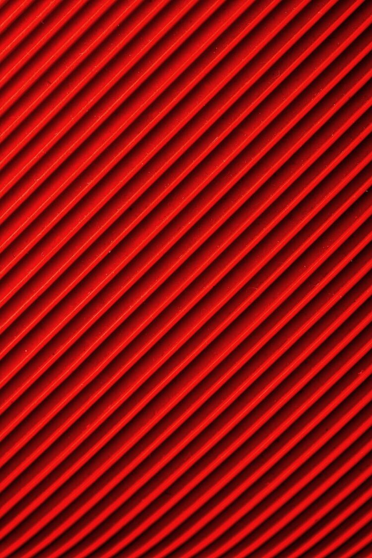 Vibrant diagonal red and black pattern, ideal for abstract backgrounds and designs.