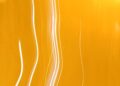 Dynamic abstract image featuring bright yellow light streaks and patterns, ideal for creative projects.