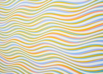 Colorful wavy lines creating an abstract and vibrant background pattern.