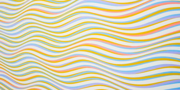 Colorful wavy lines creating an abstract and vibrant background pattern.