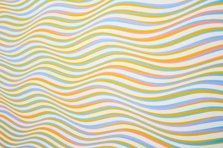 Colorful wavy lines creating an abstract and vibrant background pattern.