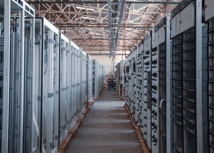 brown wooden hallway with gray metal doors