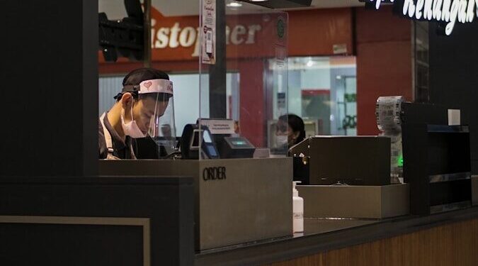 woman in black shirt sitting on chair