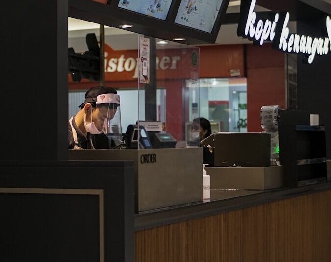 woman in black shirt sitting on chair