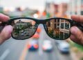 aSmart glasses reflecting a city street, symbolizing the independence AI glasses give to blind veterans