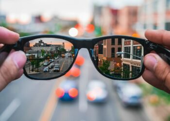 aSmart glasses reflecting a city street, symbolizing the independence AI glasses give to blind veterans