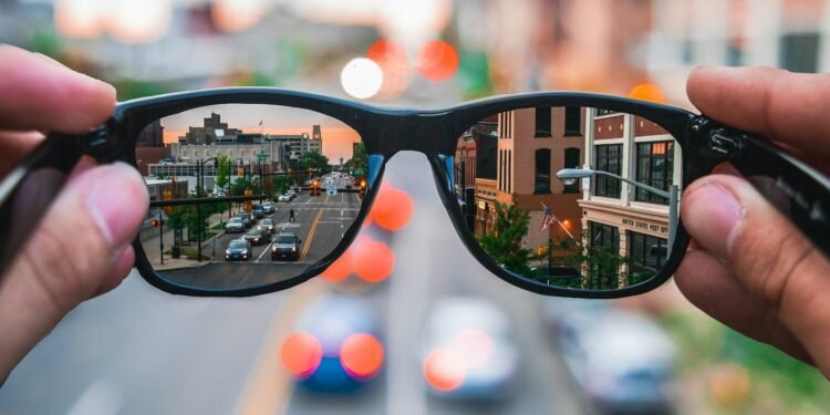 aSmart glasses reflecting a city street, symbolizing the independence AI glasses give to blind veterans