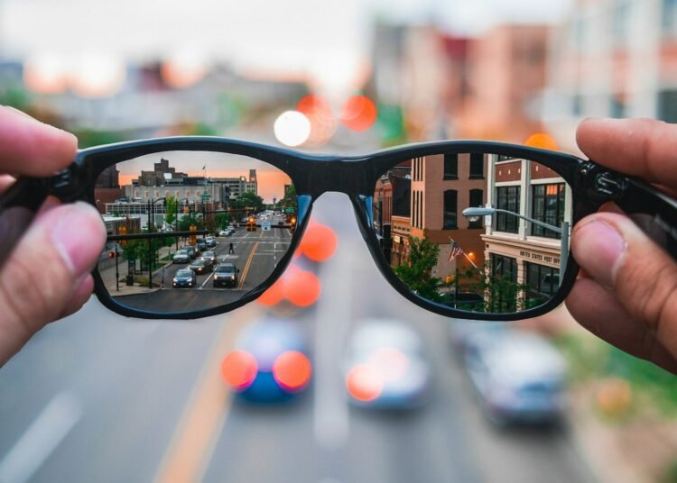 aSmart glasses reflecting a city street, symbolizing the independence AI glasses give to blind veterans