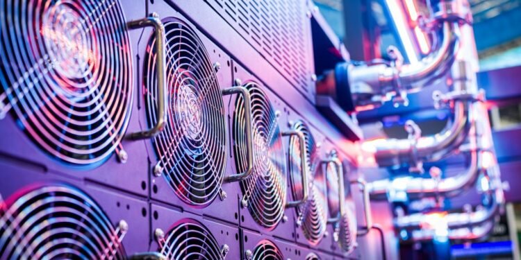 Close-up of server cooling fans in a vibrant data center
