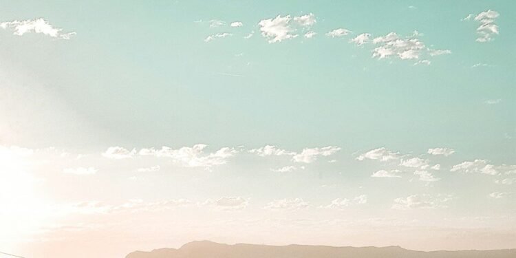 Open road stretching toward the horizon, a symbol of hope and forward progress