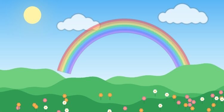 A rainbow over green hills and flowers under a bright blue sky