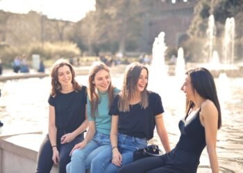 Friends chatting and laughing together outdoors