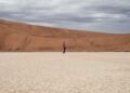 Lone Figure Vast Desert photo