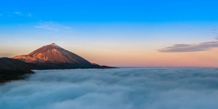 Mountain Peak Above Clouds photo