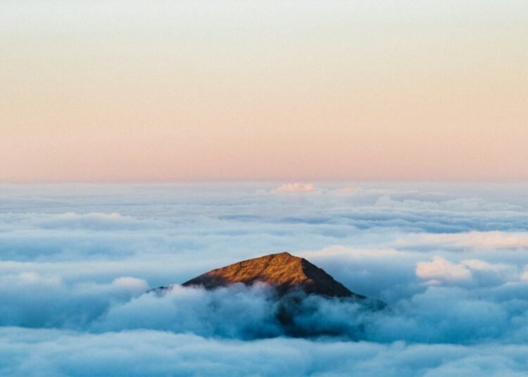 Mountain Peak Above Clouds photo