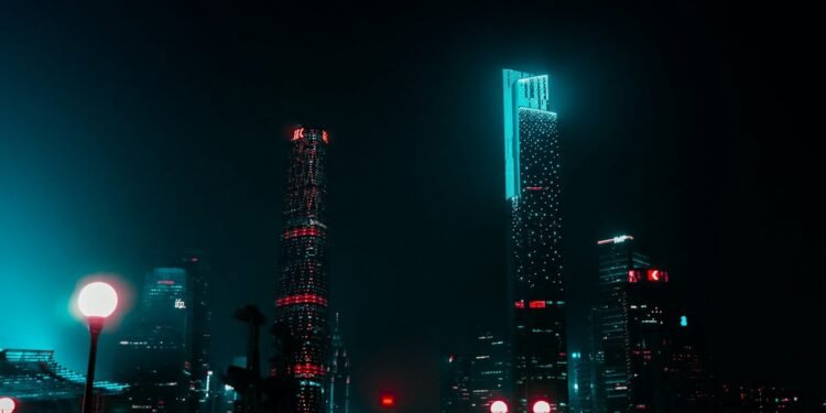 Neon lit city street at night