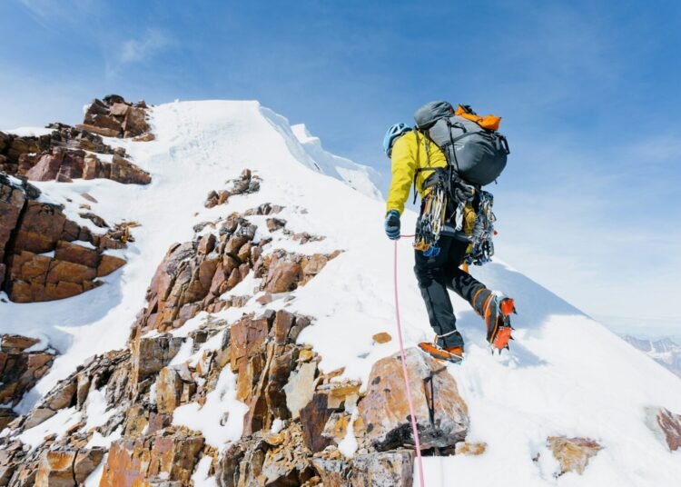 Climber Summit Mountain photo