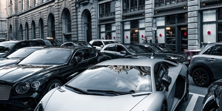 Luxury sports cars parked on an urban street, Positive Phil