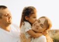 A loving family on a sunny day outdoors, Positive Phil