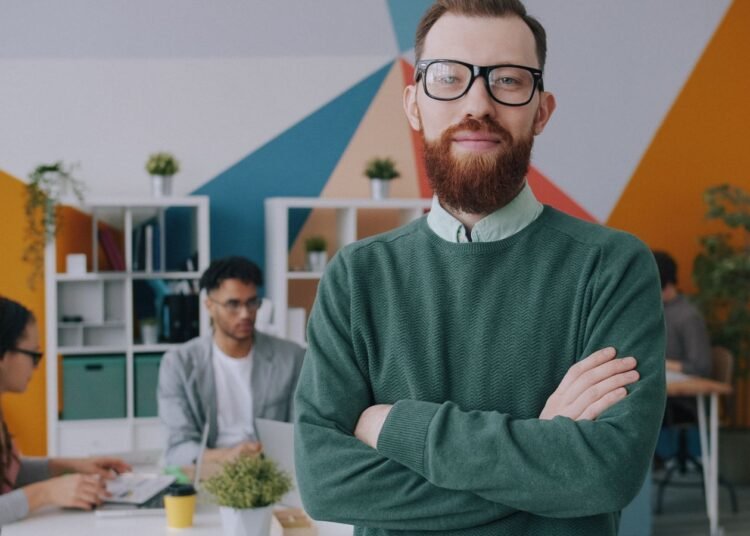 A confident professional in a creative office, Positive Phil