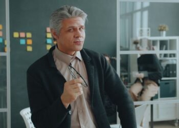 A confident senior man in an office, Positive Phil