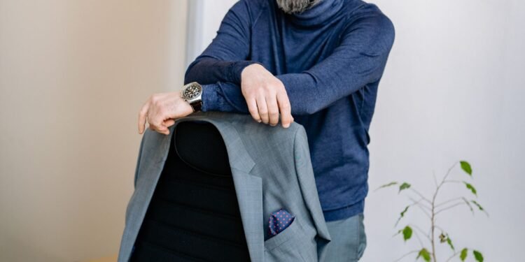 A bearded man standing in an office, Positive Phil