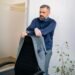 A bearded man standing in an office, Positive Phil