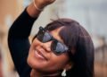 A woman in sunglasses enjoying summer, Positive Phil
