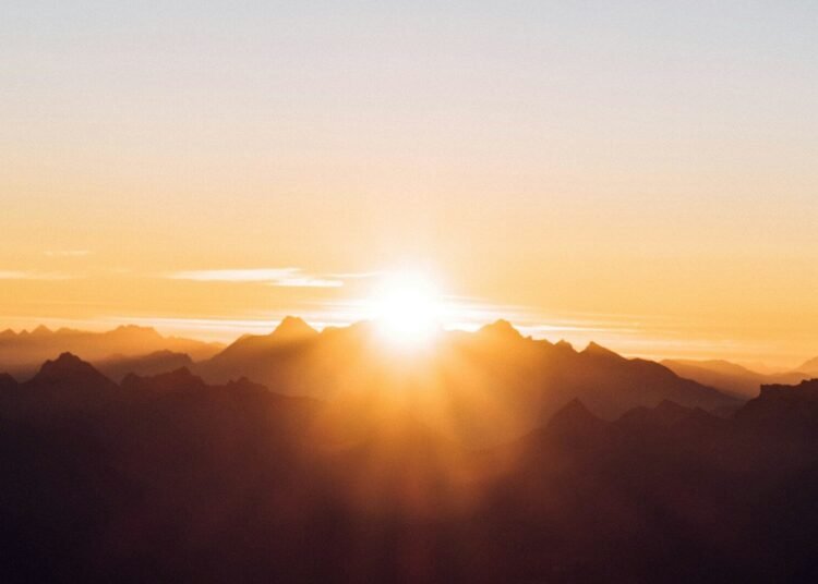 sun setting over the mountains