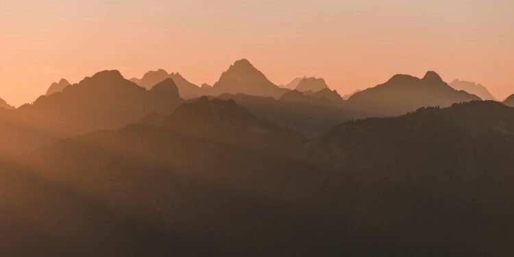 silhouette of mountains during golden hour