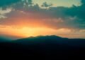 silhouette of mountains during sunset