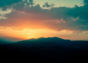 silhouette of mountains during sunset