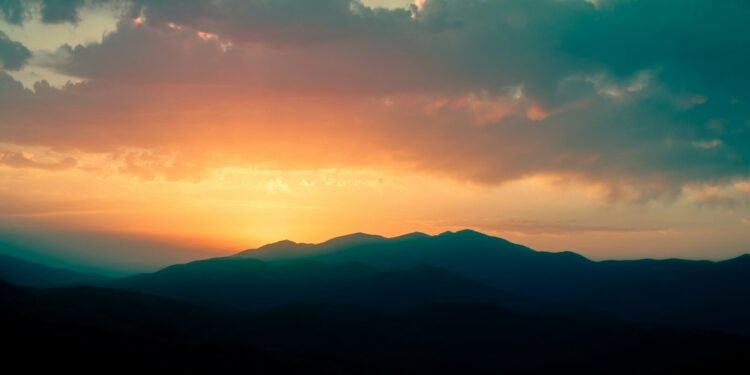 silhouette of mountains during sunset