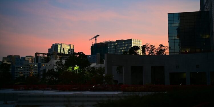 City skyline at dusk with colorful sky